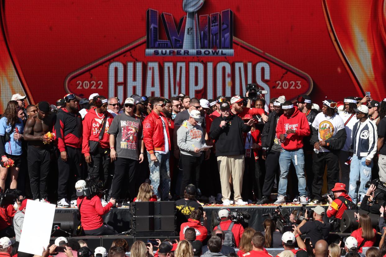 Head coach Andy Reid of the Kansas City Chiefs addresses the fans, creating what he called a "sea of red." Minutes after the team vowed a three-peat and exited the stage, gunshots rang out.