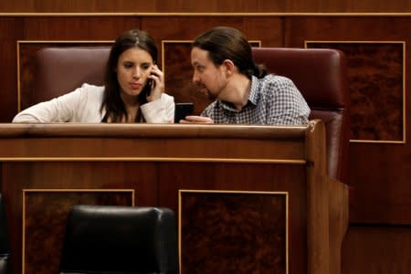 Podemos (We can) party members Pablo Iglesias and Irene Montero attend a 2018 budget plenary session at Parliament in Madrid, Spain, May 23, 2018. REUTERS/Paul Hanna