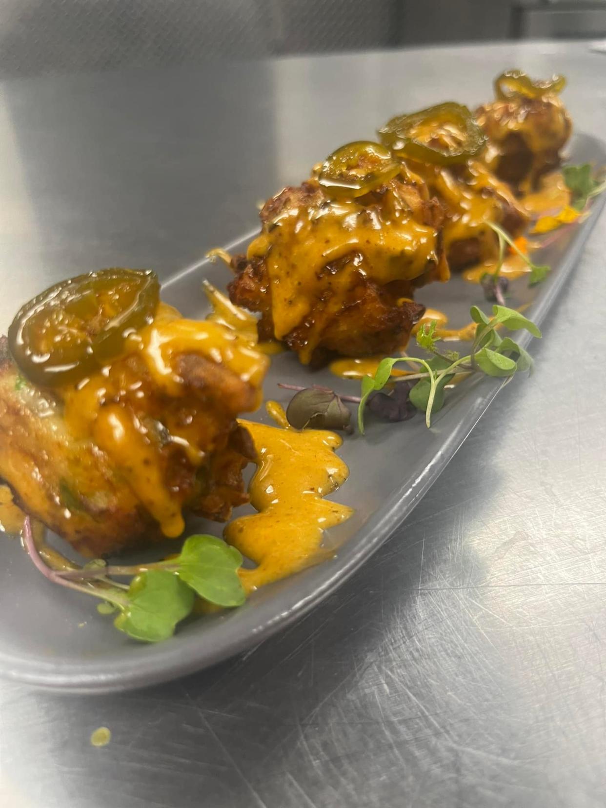 Waterfront Sailfish Lounge & Grill opened Feb. 10 at the former Mulligan’s in downtown Stuart. Its menu features Oceanside beignets with crab and shrimp fried beignets, topped with seafood bay honey Dijon.