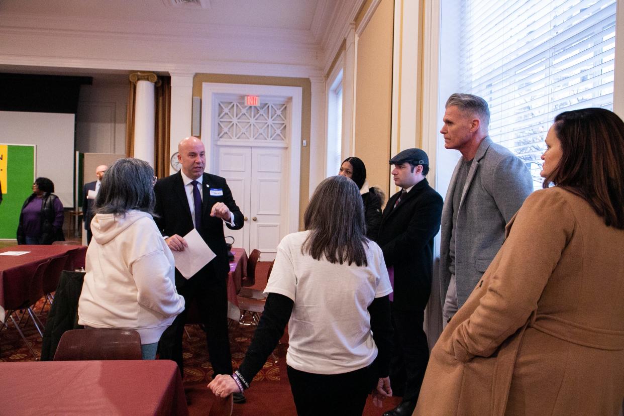 Shawn Weneta, second from left, talks with a group of advocates inside of St. Paul's Episcopal Church in January as they prepare to lobby lawmakers to gain support for criminal justice reform.