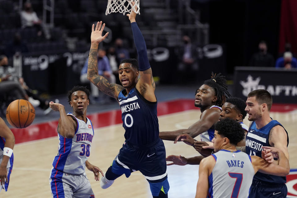 Minnesota Timberwolves guard D'Angelo Russell (0) loses control of the ball during the first half of an NBA basketball game against the Detroit Pistons, Tuesday, May 11, 2021, in Detroit. (AP Photo/Carlos Osorio)