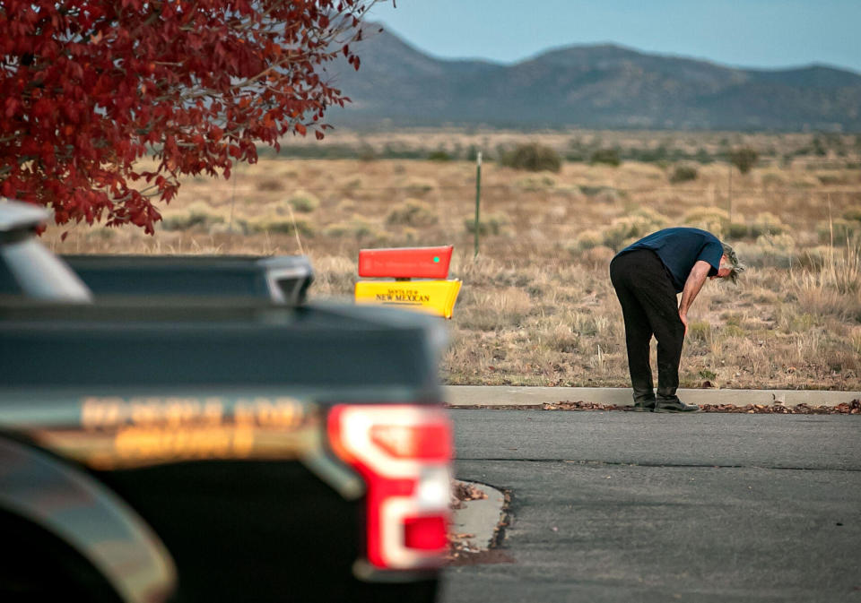  A distraught Alec Baldwin lingers in the  parking lot outside the Santa Fe County Sheriff's offices on Camino  Justicia after being questioned on October 20, 2021, about a shooting  when a prop gun misfired earlier in the day on a local movie set. / Credit: Jim Weber/The New Mexican