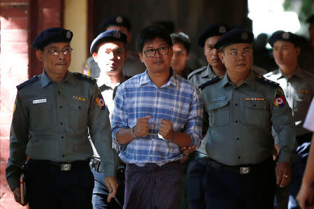 Detained Reuters journalist Wa Lone arrives at a court hearing in Yangon, Myanmar, January 23, 2018. REUTERS/Stringer