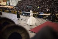 <div class="caption-credit"> Photo by: Getty Images</div>During the festivities, the bride holds the end of a long sash and stands perfectly still while rabbis, the groom's father, and some of her male relatives take turns holding the other end of the sash and dancing for her. The dances are considered a great honor.