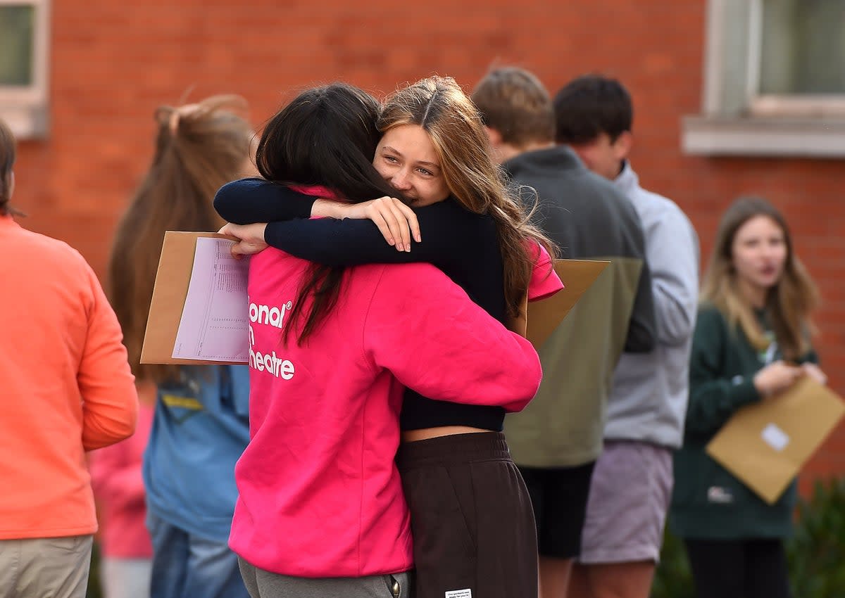 Pupils at Sullivan Upper School in Holywood, Co Down, celebrate after receiving their GCSE results (Oliver McVeigh/PA) (PA Wire)