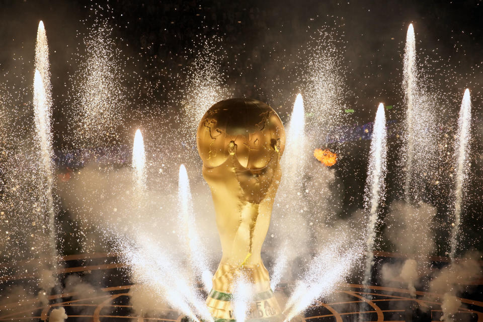 Fireworks go off on the pitch ahead of the World Cup final soccer match between Argentina and France at the Lusail Stadium in Lusail, Qatar, Sunday, Dec. 18, 2022. (AP Photo/Christophe Ena)