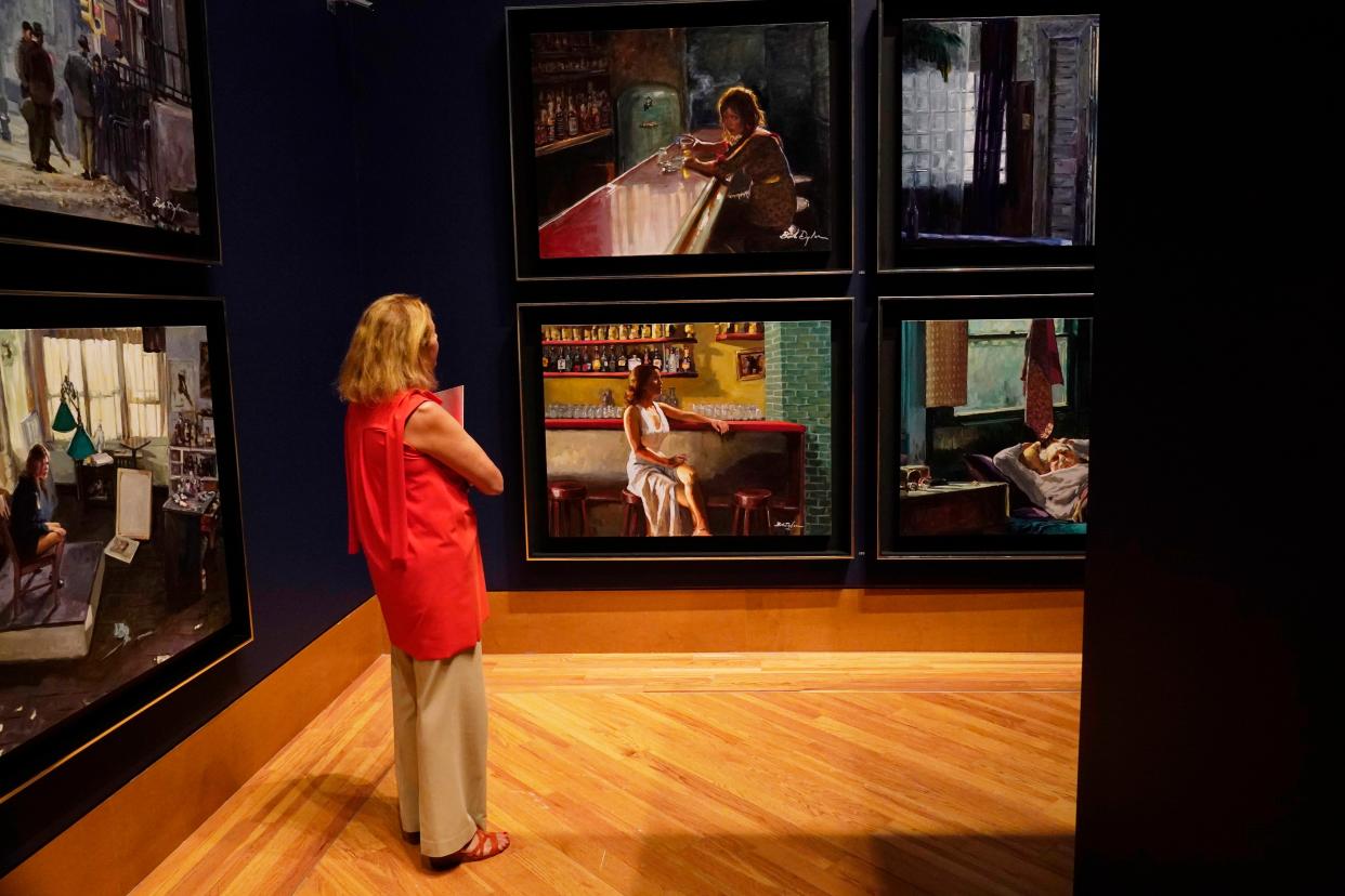 Jordana Pomeroy, director of the Patricia & Phillip Frost Art Museum, looks at a new series of paintings called "Deep Focus" by Bob Dylan, at Florida International University in Miami.