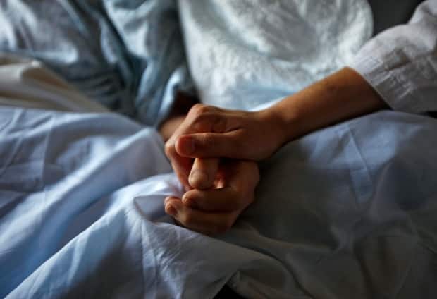 The Advocacy Centre for the Elderly, the Ontario Council of Hospital Unions and the Ontario Health Coalition say the province’s policy of 'de-hospitalizing; the health-care system and the underfunding of long-term care have had a 'disproportionately negative effect' on older people.  (Shaun Best/Reuters - image credit)