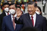 Chinese President Xi Jinping waves as they disembark their plane upon arrival at Ngurah Rai International Airport ahead of the G20 Summit in Bali, Indonesia, Monday, Nov. 14, 2022. (Ajeng Dinar Ulfiana/Pool Photo via AP)