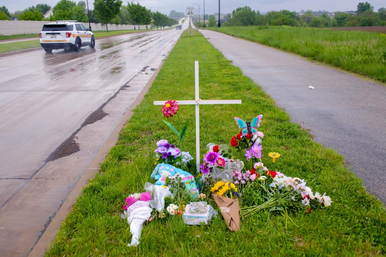 A memorial to Dunlap High school senior Nevaeh Mitchell sits along Orange-Prairie Road in North Peoria. Mitchell, 18, of Princeville died May 5, 2024, after a head-on collision late Saturday, May 4, while driving home from her job at a nearby movie theater.