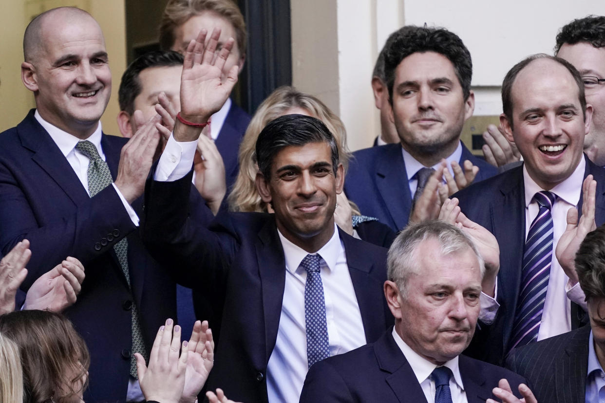 Rishi Sunak waves after winning the Conservative Party leadership contest at the Conservative party Headquarters in London on Oct. 24, 2022. (Aberto Pezzali / AP)