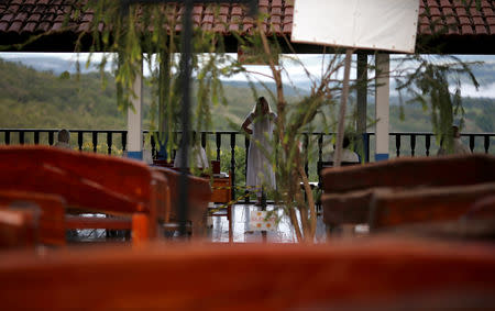 A follower of Brazilian spiritual healer Joao Teixeira de Faria, known as "John of God", is seen at "healing center" in his spiritual center, in Abadiania, Brazil December 13, 2018. REUTERS/Adriano Machado