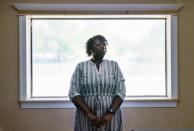 Latonya Crowley, mother of Warren Williams, stands for a portrait in Palatka, Fla., Thursday, April 22, 2021. An FBI probe revealed a murder plot against her son by klansmen working as prison guards where Williams was once an inmate. "In the state of mind that he's in today. I don't see him getting better," Crowley says, as she and her son live today with uncertainty and paranoia. One of the guards' imminent release and the specter of other klansmen have made it impossible for Williams to move on. (AP Photo/David Goldman)