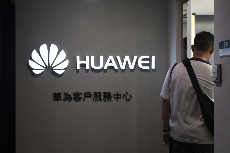 A man walks inside a Huawei's customer service center in Hong Kong, Friday, March 29, 2019.  (Photo: Kin Cheung/AP)