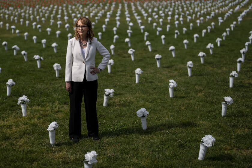 WASHINGTON, DC - JUNE 07: Former Rep. Gabrielle Giffords (D-AZ) walks through Giffords Gun Violence Memorial in front of the Washington Monument on Tuesday, June 7, 2022 in Washington, DC. (Kent Nishimura / Los Angeles Times)