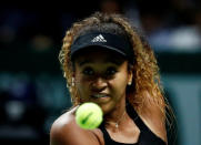 Tennis - WTA Tour Finals - Singapore Indoor Stadium, Kallang, Singapore - October 22, 2018 Japan's Naomi Osaka in action during her group stage match against Sloane Stephens of the U.S. REUTERS/Edgar Su