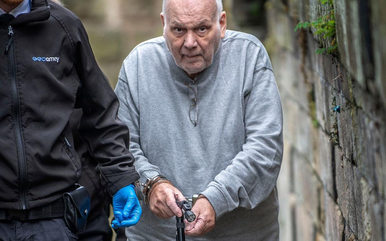 Richard Burrows in handcuffs at Chester crown court after he returned from Thailand to face the charges which were put to him 27 years ago before he went on the run.