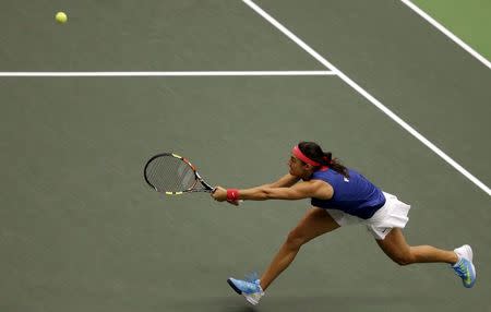 France's Caroline Garcia returns the ball to Czech Republic's Petra Kvitova during their semi-final match of the Fed Cup tennis tournament in Ostrava April 19, 2015. REUTERS/David W Cerny