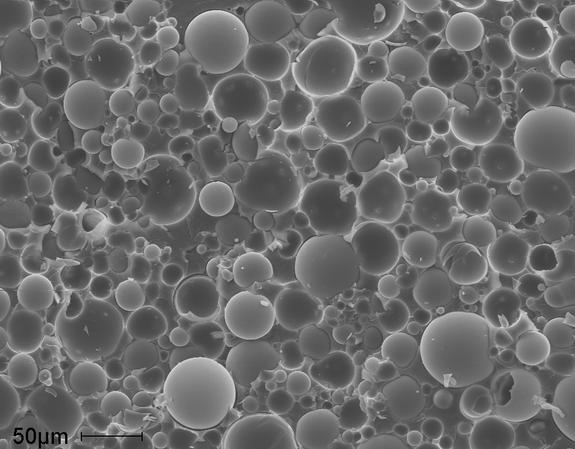 The structure of a glass, hollow-particle filled, vinyl-ester-matrix syntactic foam. The image was acquired using a scanning electron microscope.