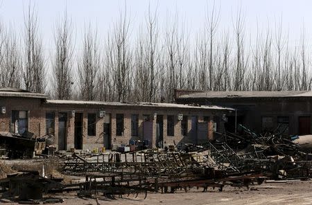 Debris is pictured outside a deserted dormitory for brick workers at a closed brick factory on the outskirts of Beijing, China, January, 18, 2016. REUTERS/Jason Lee