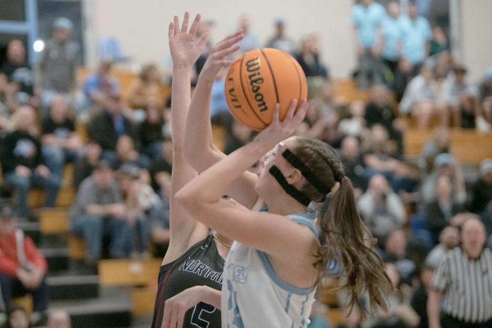 Pueblo West's Trynity Martin goes in for a layup with pressure coming from a Northridge defender on Tuesday, Feb. 21, 2023.