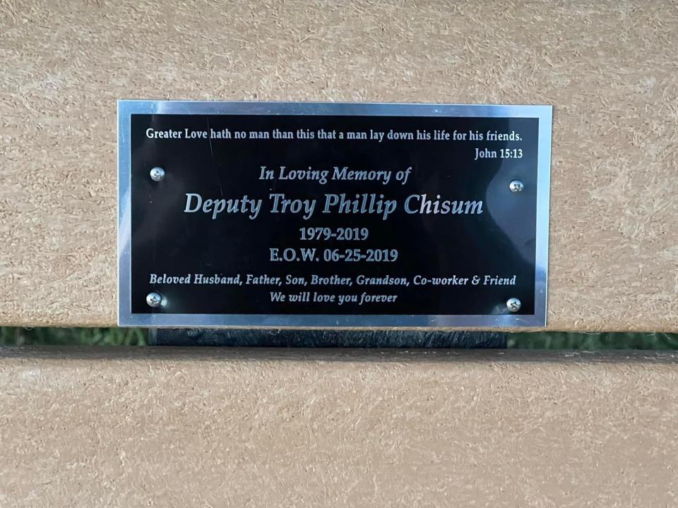 Pictured is the plaque affixed to the bench honoring Deputy Troy Chisum.