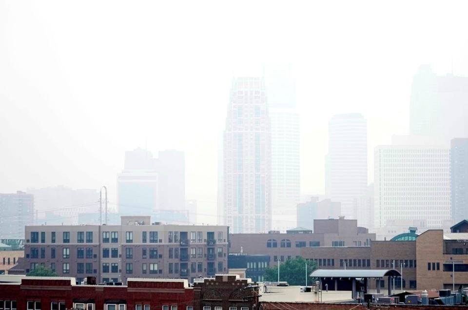 Haze from wildfire smoke envelopes the Minneapolis skyline on June 14, 2023. <a href="https://newsroom.ap.org/detail/CanadianWildfiresAirQuality/4dedf9a42ab04009a3f199e415fb66b1/photo" rel="nofollow noopener" target="_blank" data-ylk="slk:AP Photo/Abbie Parr;elm:context_link;itc:0;sec:content-canvas" class="link ">AP Photo/Abbie Parr</a>