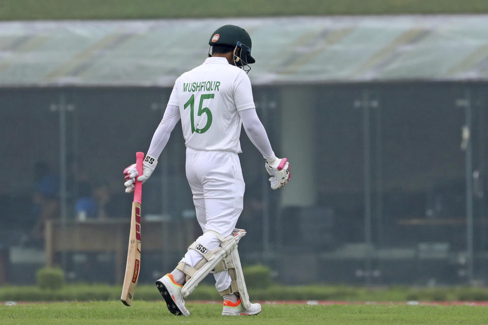 Bangladesh's Mushfiqur Rahim leaves the field after being dismissed during the fourth day of the second test cricket match between Bangladesh and New Zealand in Dhaka, Bangladesh, Saturday, Dec. 9, 2023. (AP Photo/Mosaraf Hossain)