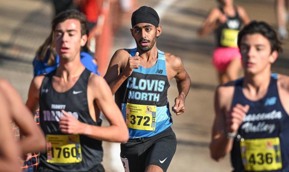 Clovis North’s Ted Pandher stays near the front in the final mile during the boys Division I state cross country championships at Woodward Park in Fresno on Saturday, Nov. 25, 2023.