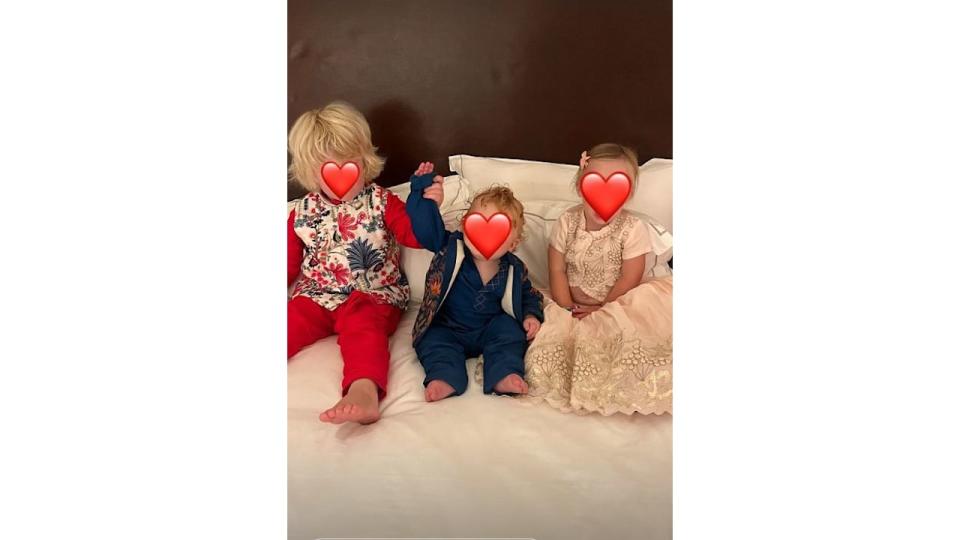 Three children in traditional wedding outfits