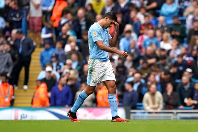 Rodri leaves the pitch after being sent off