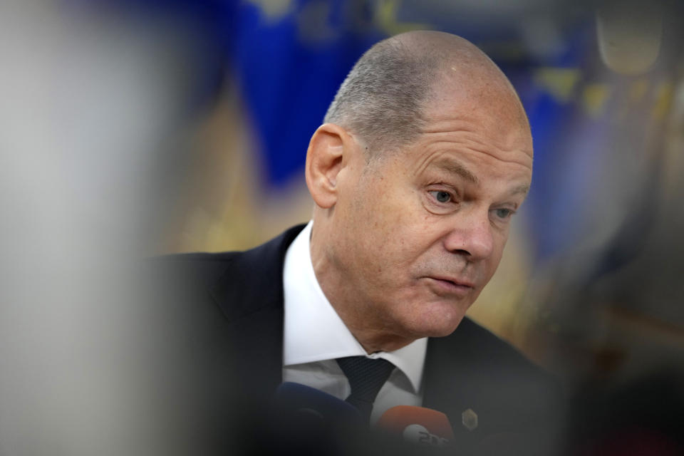 Germany's Chancellor Olaf Scholz speaks with the media as he arrives for an EU summit at the European Council building in Brussels Brussels on Thursday, Feb. 9, 2023. European Union leaders are meeting for an EU summit to discuss Ukraine and migration. (AP Photo/Virginia Mayo)