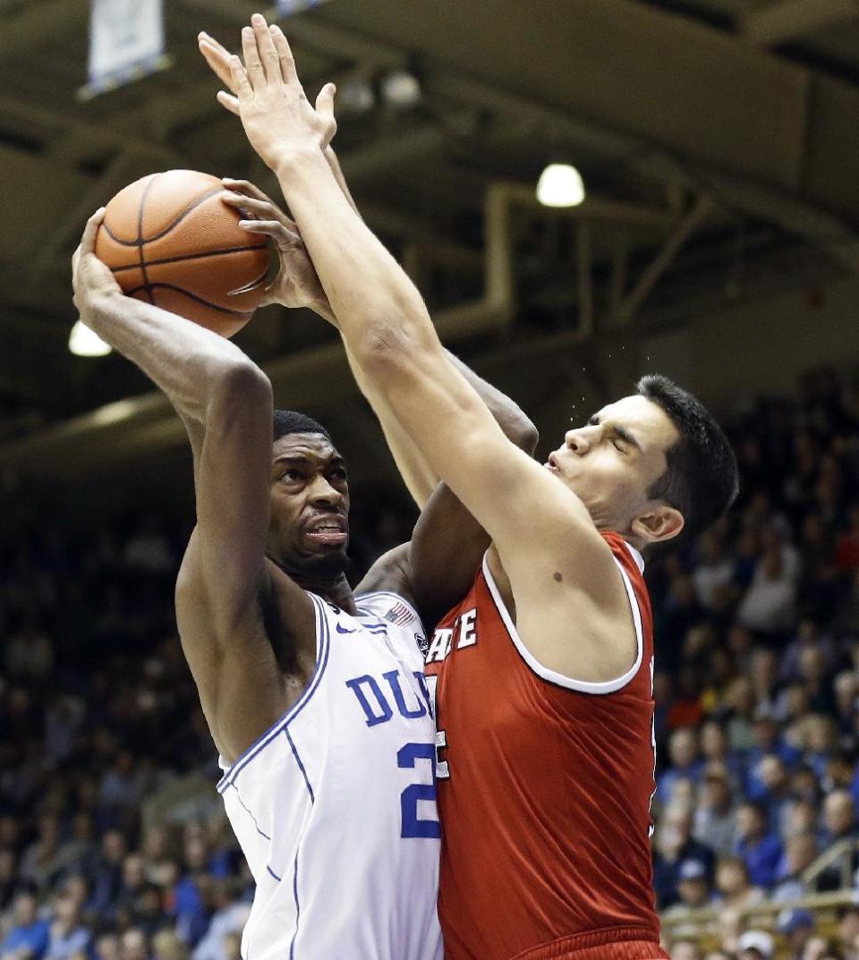 Duke's Amile Jefferson drives to the basket while N.C. State's Omer Yurtseven defends during the first half of an NCAA college basketball game in Durham, N.C., Monday, Jan. 23, 2017. (AP Photo/Gerry Broome)