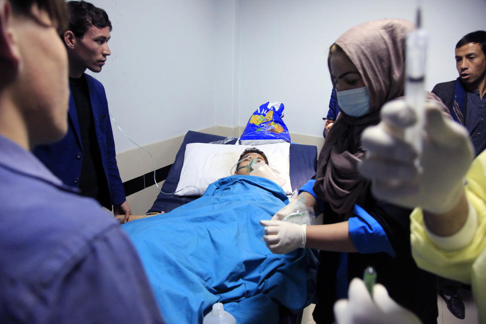 An Afghan receives treatment at hospital after suicide attack in Kabul, Afghanistan, Saturday, Oct. 24, 2020. The death toll from the suicide attack Saturday in Afghanistan's capital has risen that includes schoolchildren, the interior ministry said.. (AP Photo/Mariam Zuhaib)