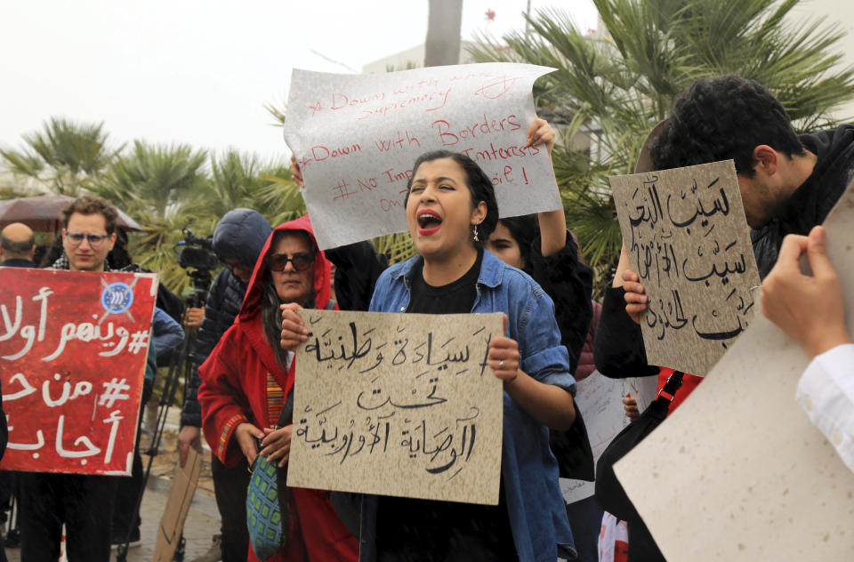 Activists demonstrate outside the delegation of the European Union to Tunisia against migrant deals with EU, in the capital Tunis, Thursday, May 9, 2024. Tensions in Tunisia are ratcheting up as authorities increasingly targeting migrants communities from the country's shoreline to its capital, where protestors staged a sit-in in front of European Union headquarters on Thursday. Banner in Arabic reads "National sovereignty under European guardianship." (AP Photo/Anis Mili)