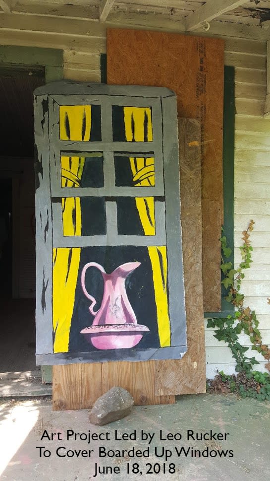 A window painting covers up boarded windows of a shotgun house in the Happy Hill section of Winston-Salem, North Carolina. (Photo courtesy of the Triad Cultural Arts. Credit: Cheryl Harry)