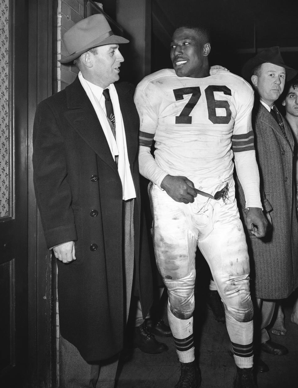 Browns fullback Marion Motley, right, with coach Paul Brown after playing Buffalo, Dec. 19, 1948, at Cleveland.