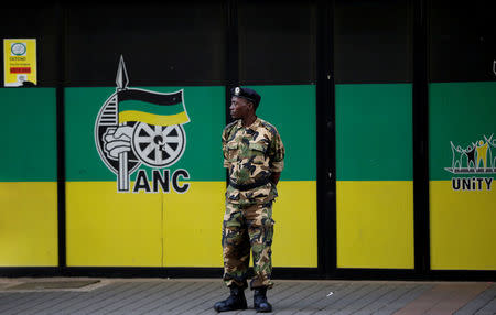 FILE PHOTO: A member of the Umkhonto We Sizwe Military Veterans Association (MKMVA) stands guard at the ANC headquarters in downtown Johannesburg, South Africa, September 5, 2016. REUTERS/Siphiwe Sibeko/File Photo