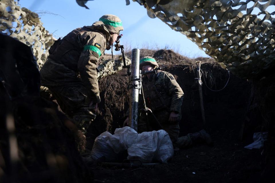 Ukrainian troops prepare to fire a mortar from a position near Bakhmut (AFP/Getty)
