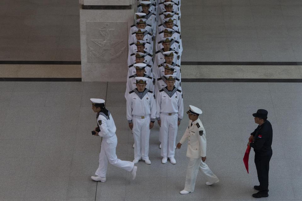 Chinese sailors visit the Chinese People's Liberation Army Naval Museum in Qingdao in eastern China's Shandong province on Tuesday, April 23, 2024. (AP Photo/Ng Han Guan)
