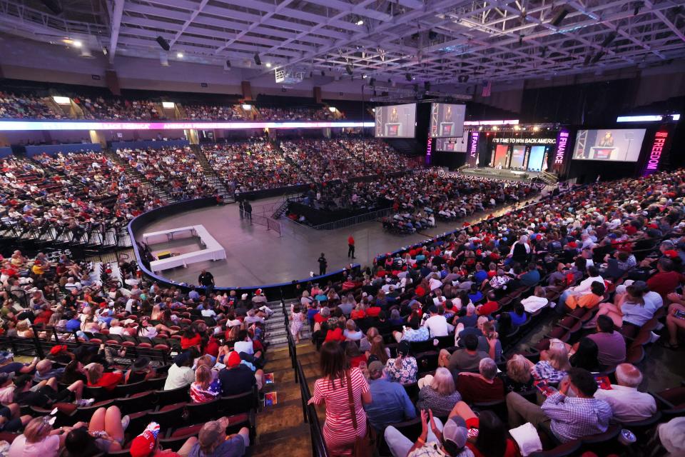 Attendees listen to Kimberley Guilfoyle, a former advisor to Donald Trump, as she speaks to the crowd gathered at the Landers Center in Southaven, Miss. on Saturday, June 18, 2022. 