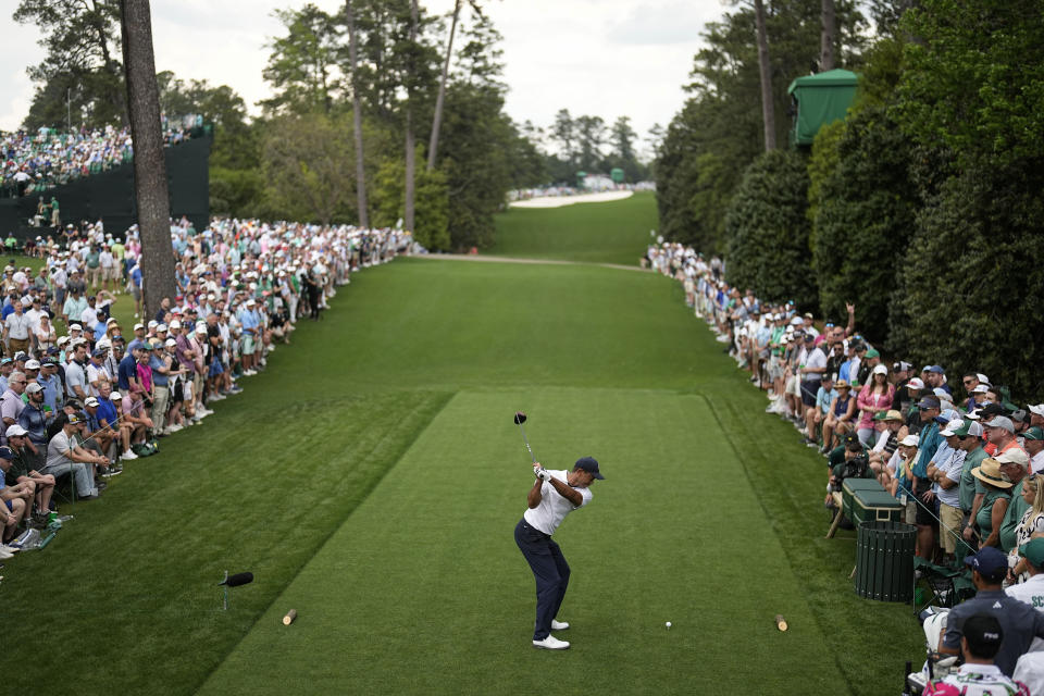 Tiger Woods hits his tee shot on the 18th hole during the first round of the Masters golf tournament at Augusta National Golf Club on Thursday, April 6, 2023, in Augusta, Ga. (AP Photo/David J. Phillip)