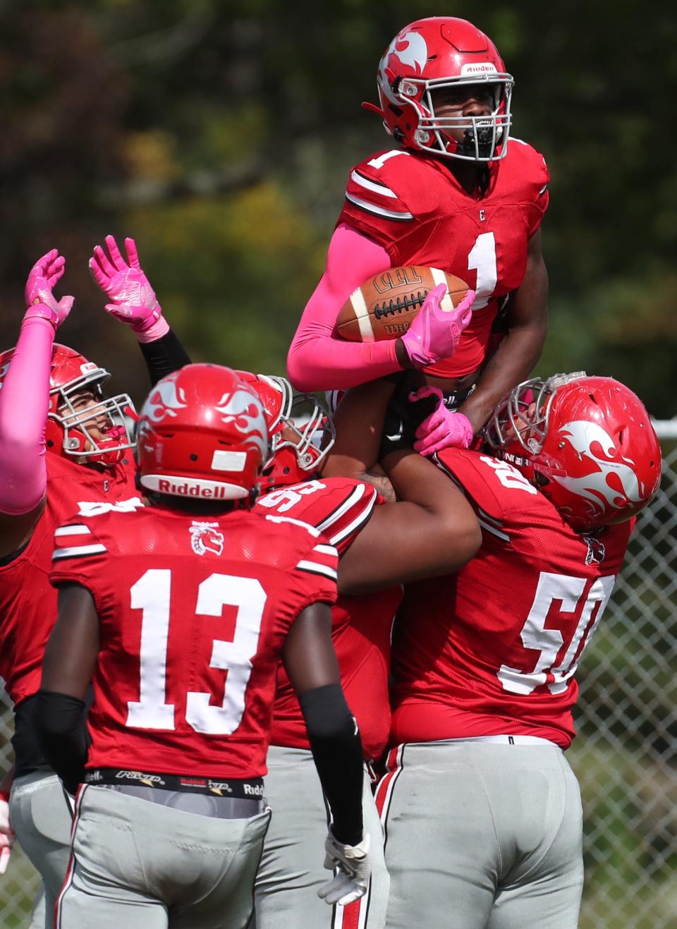 East's Eric Holley III is lifted up by his teammates after he scored against Buchtel in their City Series game at Buchtel High School on Saturday, Oct, 2, 2021 in Akron.