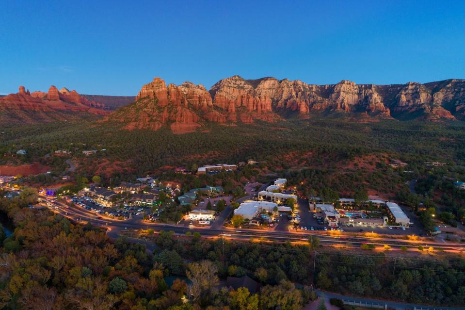 a large mountain range with a parking lot and a parking lot