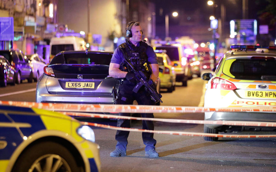 <p>An armed police officer mans a cordon on the Seven Sisters Road at Finsbury Park where a vehicle struck pedestrians in London Monday, June 19, 2017. Police say a vehicle struck pedestrians on a road in north London, leaving several casualties and one person has been arrested. (Yui Mok/PA via AP) </p>