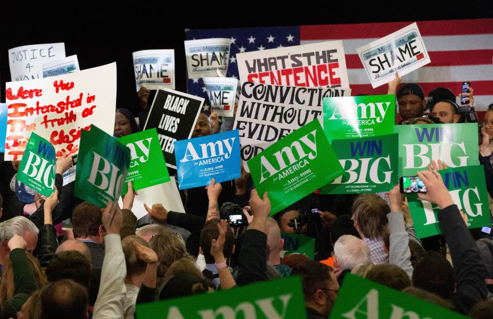 Supporters face off with protestors who took over the stage forcing Democratic presidential hopeful Minnesota Senator Amy Klobuchar to cancel her rally before it even started on March 1, 2020 in St. Louis Park, west of Minneapolis, Minnesota. - Hundreds of Klobuchar supporters witnessed a group of Black Lives Matter protesters demanding her to drop out of the race after her misshandling of Myon Burrell's case in 2002 when she was County Attorney. (Photo by Kerem Yucel / AFP) (Photo by KEREM YUCEL/AFP via Getty Images)