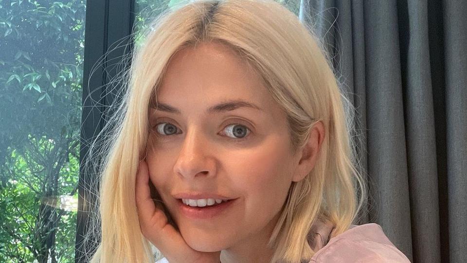 Holly Willoughby takes a selfie while drinking a cup of tea