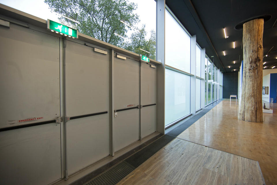 The exit doors used to take seven stolen paintings out of Kunsthal museum are seen in Rotterdam, Wednesday Oct. 17, 2012, as the museum opened it's door to the public following early Tuesday morning's heist. Police investigating a multimillion euro (dollar) art heist say they are following up several tips from the public, a day after thieves grabbed seven paintings from the walls of a Rotterdam gallery and vanished into the night. A spokeswoman for detectives on the case, Willemieke Romijn, said Wednesday they have some 15 tips from the public, following a late-night, nationally televised appeal for witnesses to the theft from the Kunsthal gallery of works by celebrated artists including Pablo Picasso, Claude Monet and Henri Matisse. (AP Photo/Peter Dejong)