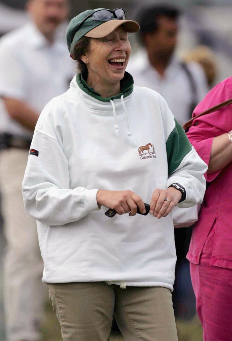 Princess Anne, the Princess Royal laughs as she watches her daughter Zara Phillips take part in the Dressage Event on the first day of the Gatcombe Horse Trials on the Gatcombe Estate on August 4, 2006 in Tetbury, England.