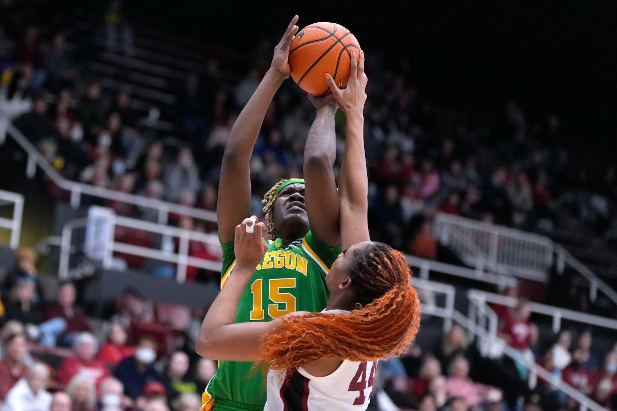 Stanford forward Kiki Iriafen (44) blocks a shot by Oregon center Phillipina Kyei (15) during the first half of an NCAA college basketball game Friday, Jan. 19, 2024, in Stanford, Calif. (AP Photo/Tony Avelar)